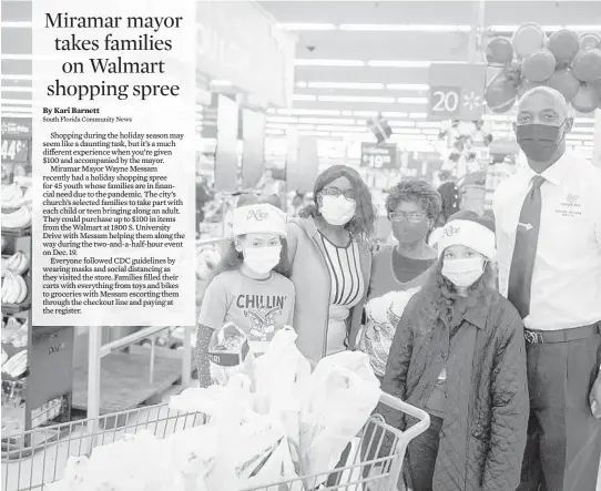  ?? GREGORY F. REED/COURTESY ?? Families in need had the opportunit­y to shop for items at Walmart with Miramar Mayor Wayne Messam just before Christmas.