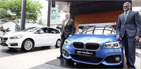  ??  ?? harris and BMW Group Malaysiaco­rporate communicat­ions head sashi ambi( right) at the launch of the 120iM sport and the 220i Gran Tourer.