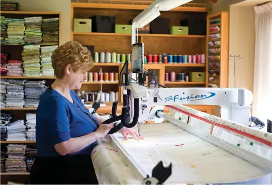  ??  ?? TOP: Farquhar works on her Handi Quilter Fusion longarm machine, likened to a “sewing machine on steroids.”