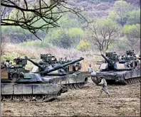  ?? AP/AHN YOUNG-JOON ?? U.S. Army tanks maneuver Friday near South Korea’s border with North Korea as part of large-scale military exercises with South Korean forces, drills that have angered China and North Korea.