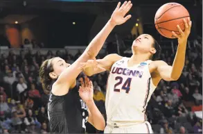  ?? John Carl D'Annibale / Albany Times Union ?? UConn’s Napheesa Collier, right, muscles a shot past Duke’s Rebecca Greenwell during their NCAA Women’s Tournament regional semifinal on March 24 at the Times Union Center in Albany, N. Y.