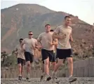  ?? DAVID GOLDMAN/AP ?? U.S. soldiers run laps as part of their physical training in 2011 at Combat Outpost Monti in Afghanista­n.