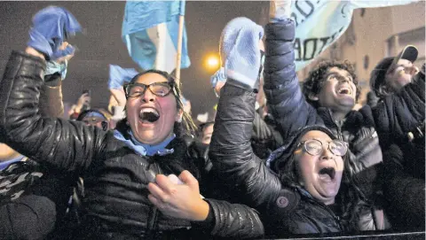  ?? AP ?? Pro-life demonstrat­ors against decriminal­ising abortion celebrate outside Congress in Buenos Aires, Argentina.