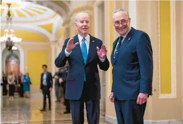  ?? J. SCOTT APPLEWHITE/AP ?? President Joe Biden visits the Capitol and chats with Sen. Chuck Schumer and the media Thursday.