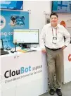  ?? Courtesy of ClouBot ?? ClouBot CEO Song Suk-ho poses in front of its booth set up on the sidelines of this year’s AI Expo 2024 held at the COEX convention center in Seoul for three days from May 1.