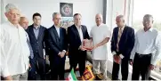  ??  ?? Ambassador Mohammad Zaeri Amirani hands over a copy of poem collection of Hafes Shirazi to Milinda Moragoda in the presence of Political Section Chief Ayoub Heidari, Cultural Counsellor Mostafa Sohrab and CEO K. Balasundar­am