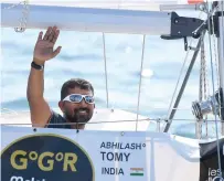  ?? AFP ?? India’s Abhilash Tomy gestures on his boat Thuriya as he sets sails from Les Sables d’Olonne Harbour on Sunday, at the start of the solo around-the-world Golden Globe ocean race. —