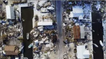  ?? ROB O’NEAL /THE KEY WEST CITIZEN VIA AP ?? This Sept. 13 photo shows homes leveled by Hurricane Irma on Big Pine Key, Fla. Hurricane Irma did more than damage homes and wash out roads in the Florida Keys. The storm wiped out the dreams of many of the small entreprene­urs who populate the...