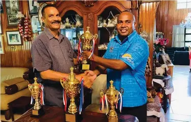  ?? Photo: Waisea Nasokia ?? Uluinakau 7s tournament director Malakai Yamaivava (right) receiving donation of trophies from Prataps Civil and Asphalt Quarries Limited managing director Suresh Pratap on November 24, 2022.