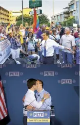  ??  ?? At last year’s gay-pride parade in Austin, Texas; with Chasten, officially announcing his run in Indiana