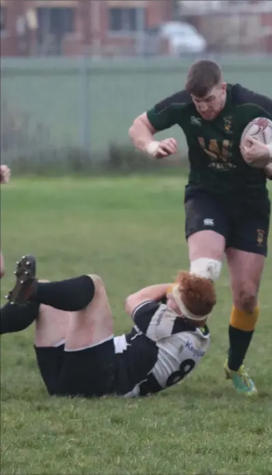  ?? Pictures: Judith ?? Boyne skipper Karl Keogh is stopped in his tracks by his Dundalk opposite number Tiernan Gonnelly.