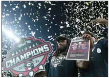  ?? (AP/Darron Cummings) ?? Georgia players celebrate after the College Football Playoff championsh­ip football game. ACC Commission­er Jim Phillips spoke out against a possible 2024 playoff expansion Friday, citing uncertaint­y as a major drawback.