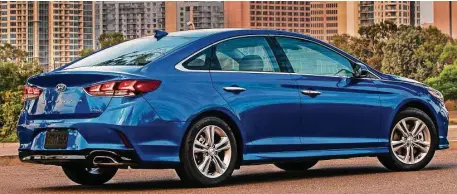  ??  ?? Hyundai has updated the Sonata midsize sedan for 2018, adding some new exterior touches including a cascading grille, slim LED taillights, along with LED daytime running lights and backup lights.