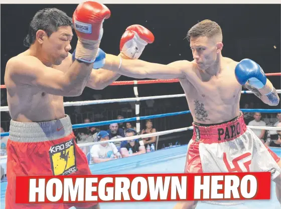  ?? BOXING CLEVER: Townsville boxer Liam Paro lands a left during his win over Komkit Chanawong in Townsville at the weekend. Picture: CLIVE FRANKLIN ??