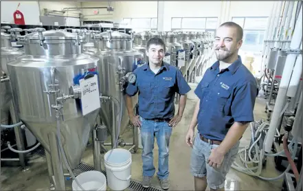  ?? JULIE JOCSAK / STANDARD STAFF ?? Mike Hueftlein, left, and Lucas Goerzen, second-year Niagara College Brewmaster and Brewery Operations students, are two of 17 students who will be showcasing their brewing skills during Project Brew, a craft beer festival that will take place in Market Square.