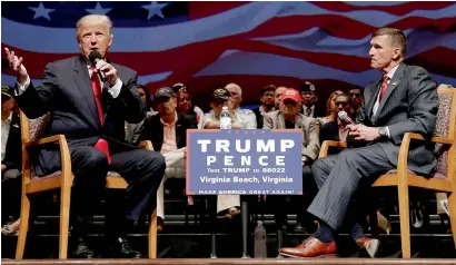  ?? Reuters file ?? Donald Trump speaks along Michael Flynn during a poll campaign town hall meeting in Virginia Beach, Virginia. —