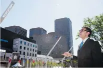  ?? PHOTOS (2): DARIO AYALA, GAZETTE FILES ?? Urban design expert Clarence Epstein discusses the design features of Place des Festivals, next to Place des Arts, during the 2010 Montreal Internatio­nal Jazz Festival in downtown Montreal.