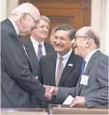  ?? FILE PHOTO BY JAYWESTCOT­T FOR USA TODAY ?? Former Fed chiefs Paul Volcker, left, and Alan Greenspan say their hellos as Jeffrey Lacker looks on ahead of an event commemorat­ing the signing of the Federal Reserve Act in 2013.