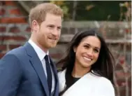  ?? CHRIS JACKSON/GETTY IMAGES ?? Prince Harry and actress Meghan Markle during an official photocall to announce their engagement at The Sunken Gardens at Kensington Palace on November 27 in London, England. Prince Harry and actress Meghan Markle announce their engagement at Kensington Palace on Monday.