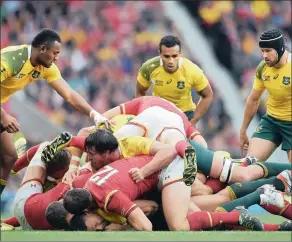  ?? EPA ?? WHERE’S THE BALL? There were no tries but Australia’s 15-6 win over Wales was absorbing.