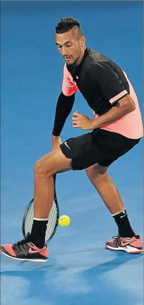  ?? Picture: AFP ?? TRICKY: Australia's Nick Kyrgios plays a shot through his legs when facing France's Jo-Wilfried Tsonga on day five of the Australian Open yesterday