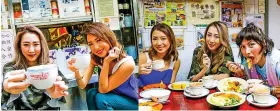  ??  ?? “A Taste of Hong Kong” host Josie Ho wraps on another photoshoot in the heart of Old Town Central, and heads over to Lan Fong Yuen where she meets Kryz and Daphne for a Hong Kong-style noodle and French toast lunch, washed down by pantyhose tea at this...