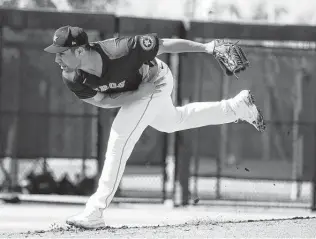  ?? Karen Warren / Staff photograph­er ?? A slimmer Andre Scrubb also has done some fine-tuning to his pitching by shortening the stride in his delivery. He has thrown three scoreless innings so far this spring.