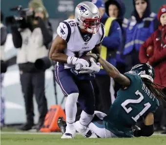  ?? GETTY IMAGES ?? FIRST LOOK: Patriots rookie wideout N’Keal Harry catches a ball as Eagles defensive back Ronald Darby defends on Sunday in Philadelph­ia.