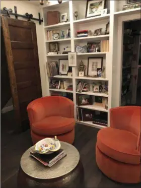  ?? SAM PARVEN VIA AP ?? Cari Shane’s renovated row house in Washington D.C. Shane took her college-aged daughter’s advice and used backwards facing books to decorate a living space.