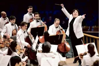  ?? HILARY SCOTT ?? On Friday, Xian Zhang, music director of the New Jersey Symphony, made her Tanglewood debut, leading the BSO in works by Copland and Dvorák.