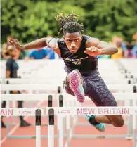  ?? ?? East Hartford’s Dayon Davis competes in the preliminar­ies of the 110-meter hurdles at the Connecticu­t State Open High School Track Championsh­ips.