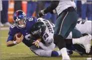  ?? SETH WENIG - THE ASSOCIATED PRESS ?? New York Giants quarterbac­k Daniel Jones (8) is sacked by Philadelph­ia Eagles defensive tackle Timmy Jernigan (93) in the second half of an NFL football game, Sunday, Dec. 29, 2019, in East Rutherford, N.J.