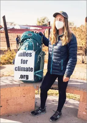  ?? Contribute­d photo ?? Hannah Bacon, 27, of New Milford, is walking across the country after losing her job during the pandemic. The UConn graduate, who worked in the environmen­tal field, is walking to raise awareness for climate change and raise money for Sunrise Movement, a youth-led grassroots organizati­on pushing a nationwide policy on renewable energy.