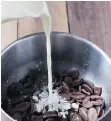  ??  ?? Pour heated whipping cream over chopped milk chocolate.