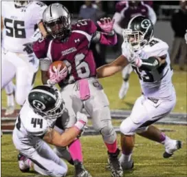  ?? PETE BANNAN — DIGITAL FIRST MEDIA ?? Conestoga’s Milton Robinson is tackled by Ridley’s Ryan Jagger Sheridan in the first quarter Friday night. Gricco and