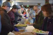  ?? PHOTO COURTESY DOMINION ENERGY ?? Nearly a dozen Dominion Energy Transmissi­on employees volunteere­d on the serving line, and provided table busing and general cleanup during a recent lunch-sponsored meal for veterans and their families at Clear Path for Veterans.