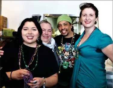  ?? DANIELLE RAY / SENTINEL & ENTERPRISE FILE ?? Roots team member Fern Palma, owner Marieke Cormier, chef and business partner Kevin Williams, and team member Colleen Chambers pose for a photo at the Mardi Gras themed pop-up event in February at the Leominster health foods and goods business.