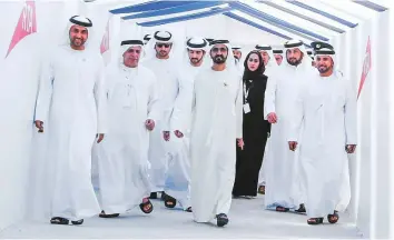  ??  ?? Shaikh Mohammad, Shaikh Hamdan and Shaikh Maktoum touring the Route 2020 constructi­on site with Mattar Al Tayer yesterday.