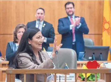  ?? EDDIE MOORE/JOURNAL ?? U.S. Rep. Deb Haaland, D-N.M., is applauded by New Mexico House Speaker Brian Egolf, D-Santa Fe, after she spoke to a joint session of the Legislatur­e in Santa Fe on Monday.