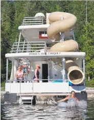  ?? Margo Pfeiff / Special to The Chronicle ?? The houseboat lacks for nothing, including a spiral slide that keeps the travelers amused.