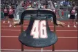  ??  ?? The iron bell with Ryan Rutledge’s No. 46 was dedicated before Friday’s Pomperaug football game.