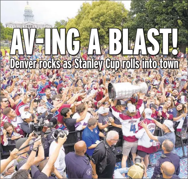  ?? AP ?? The celebratio­n is on as Avalanche defenseman Bowen Byram hoists Stanley Cup before thousands of Colorado fans after championsh­ip parade Thursday in Denver.
