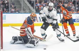  ?? JASON FRANSON – THE CANADIAN PRESS VIA AP ?? The Sharks’ Evander Kane can’t get his shot past Oilers goalie Al Montoya in the third period Wednesday. San Jose came away with the overtime win in Edmonton.