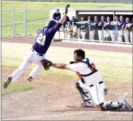  ?? Photo by Mike Eckels ?? Berryville’s Thomas Trowbridge (21) tries to leap out of the way of Gravette’s Kenton Tajchman’s (17) mitt at Gravette on April 14. Trowbridge was tagged out by Tajchman.