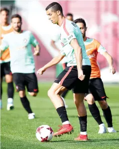  ?? — AFP photo ?? Portugal’s forward Cristiano Ronaldo (R) controls the ball during a training session ahead of the Russia 2017 Confederat­ion Cup football tournament in Kazan on on June 16, 2017.