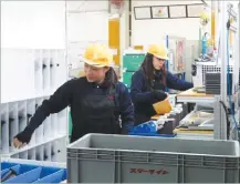  ??  ?? REUTERS Two trainees from the Philippine­s work at a car parts plant in Akitakata, Hiroshima Prefecture, Japan.