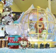  ??  ?? Kids can enjoy playing with the snow at the SM Mall of Asia Snow Globe.