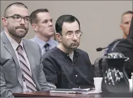  ?? Carlos Osorio Associated Press ?? LARRY NASSAR, center, was sentenced to 40 to 175 years in prison for molesting young gymnasts and others. Said the judge: “I’ve just signed your death warrant.”