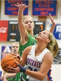  ?? STAFF PHOTO BY MATT HAMILTON ?? Northwest Whitfield’s Autumn Wiley goes up to shoot as Pickens High School’s Cassidy Richards defends during the GHSA Region 7-AAAA title game Friday night at Northwest in Tunnel Hill, Ga.