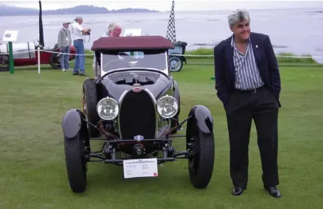  ?? MARK RICHARDSON/TORONTO STAR FILE PHOTO ?? Jay Leno, who actually drives the amazing cars in his collection, with his 1927 Bugatti at Pebble Beach, in August 2003.
